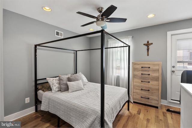 bedroom with ceiling fan and wood-type flooring