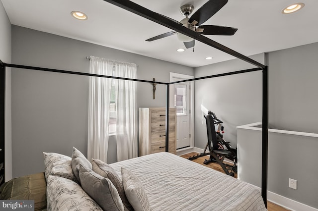 bedroom featuring wood-type flooring and ceiling fan