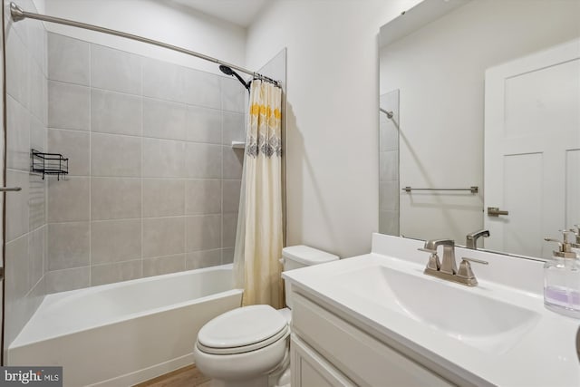 full bathroom with vanity, toilet, and shower / bath combo with shower curtain