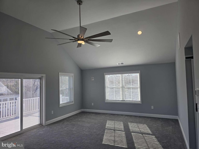 carpeted empty room with high vaulted ceiling and ceiling fan