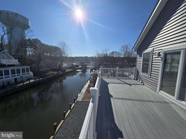 wooden deck with a water view