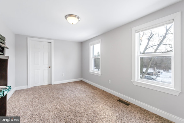 unfurnished bedroom with carpet floors