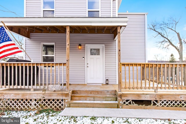 view of snow covered property entrance