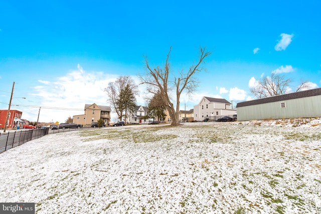 view of yard layered in snow