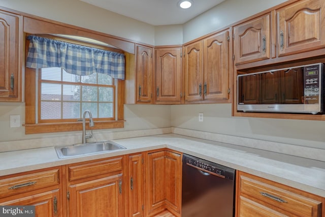 kitchen featuring dishwasher and sink