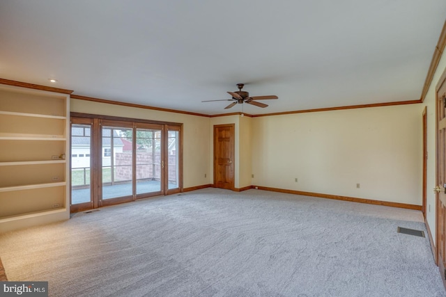 unfurnished living room featuring ceiling fan, light colored carpet, and ornamental molding