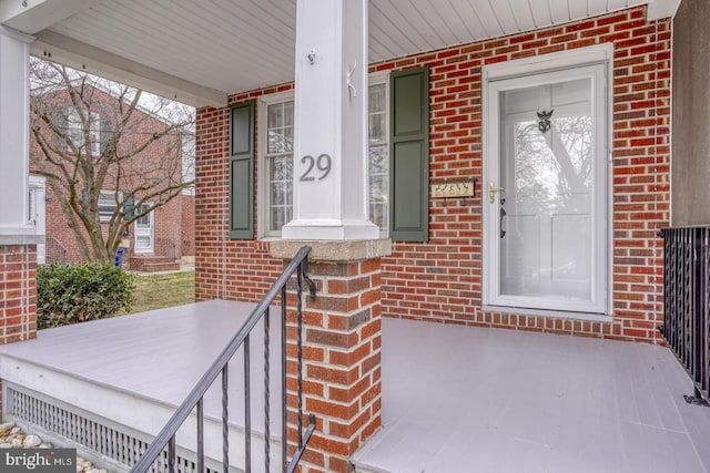 property entrance with covered porch