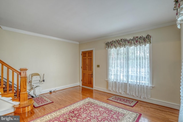 interior space featuring ornamental molding and hardwood / wood-style flooring