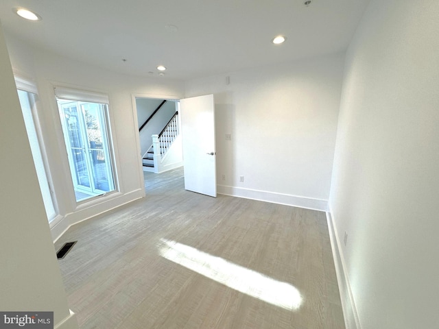 unfurnished room featuring light hardwood / wood-style floors