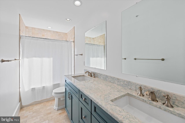 full bathroom featuring toilet, vanity, and shower / bath combo