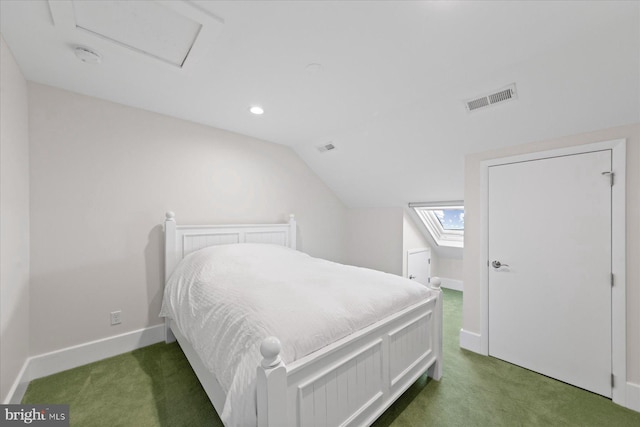 carpeted bedroom with vaulted ceiling