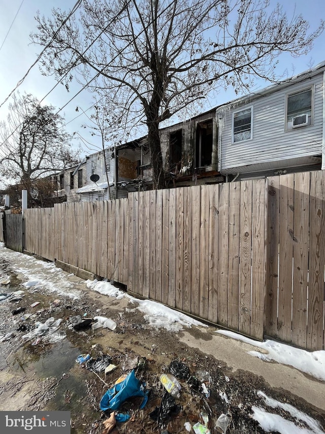 snowy yard with cooling unit