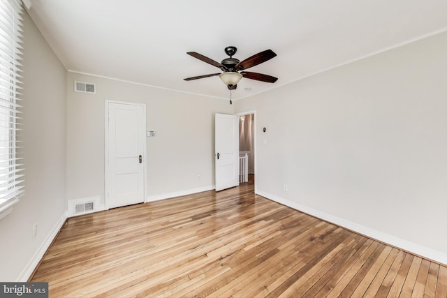 unfurnished bedroom featuring light wood-type flooring and ceiling fan