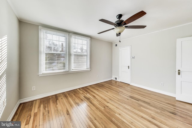 unfurnished room with ceiling fan and light hardwood / wood-style flooring