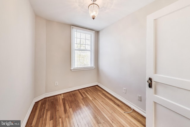 spare room featuring hardwood / wood-style floors