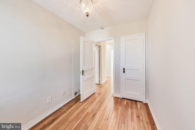 unfurnished bedroom with light wood-type flooring