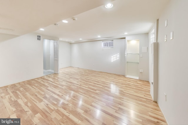 basement featuring light hardwood / wood-style floors