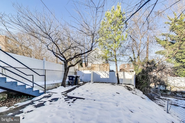 view of yard covered in snow