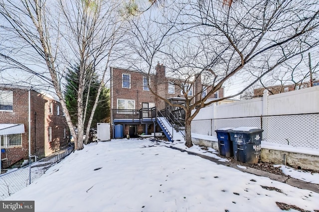 view of yard layered in snow