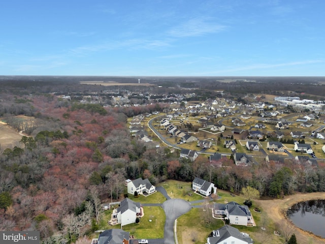 bird's eye view with a residential view and a water view