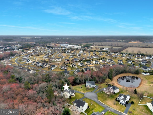 bird's eye view with a residential view and a water view