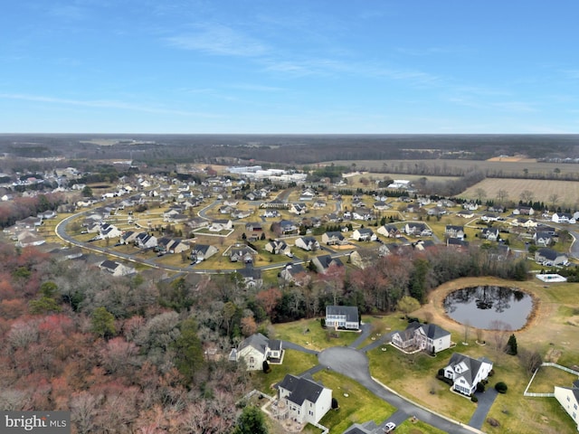 drone / aerial view featuring a residential view and a water view