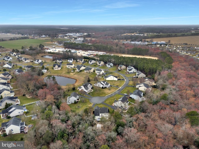 bird's eye view with a residential view and a water view