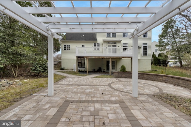 view of patio / terrace with a pergola and a deck