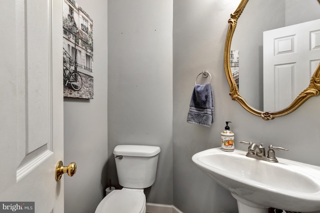 bathroom featuring toilet and a sink