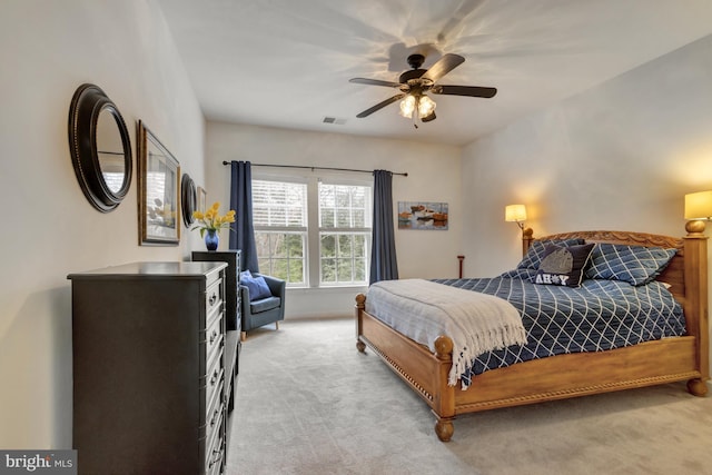 bedroom featuring visible vents, a ceiling fan, and carpet flooring