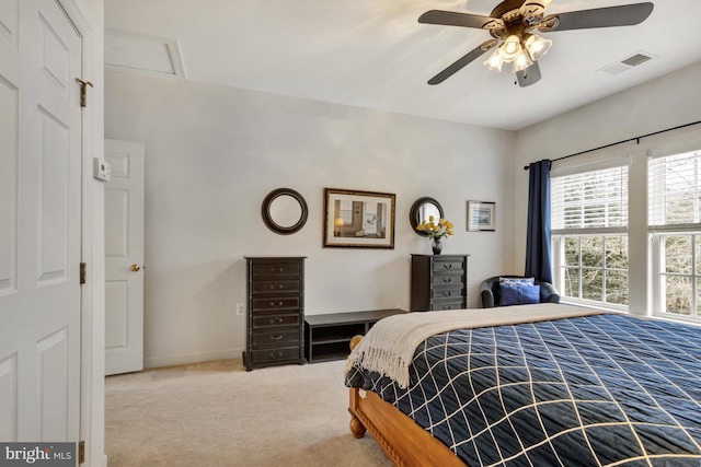 bedroom featuring visible vents, baseboards, a ceiling fan, and carpet flooring