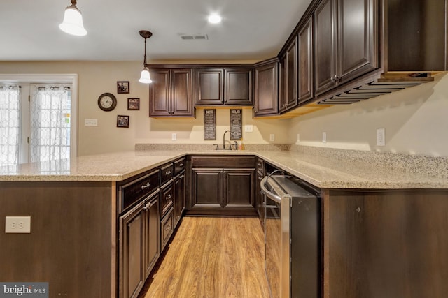 kitchen with light wood finished floors, visible vents, dark brown cabinets, dishwasher, and a peninsula