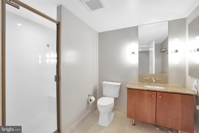 bathroom with vanity, backsplash, toilet, and an enclosed shower