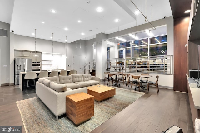 living room featuring a high ceiling