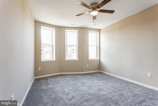 carpeted empty room with ceiling fan