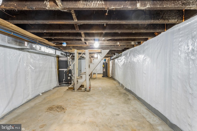 basement with heating unit and water heater