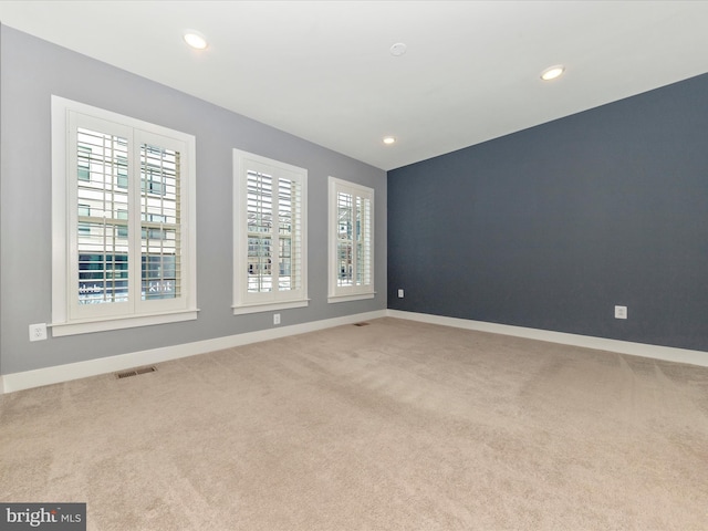 empty room with light colored carpet