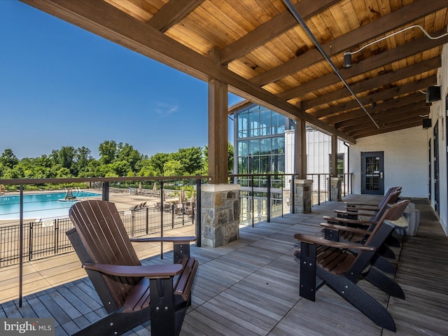 deck featuring a community pool