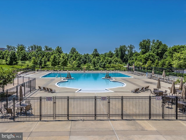 view of swimming pool featuring a patio area