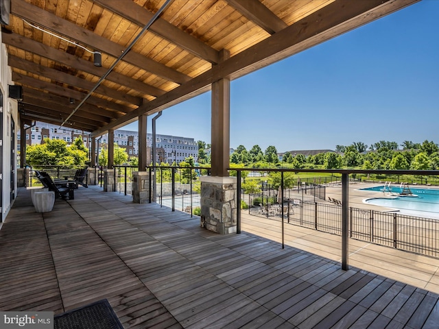 deck featuring a community pool