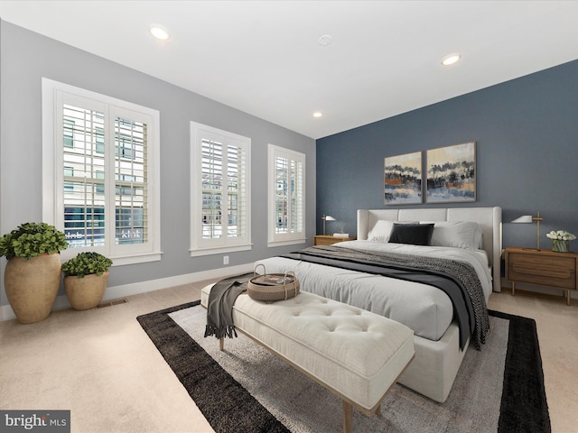 bedroom featuring light colored carpet