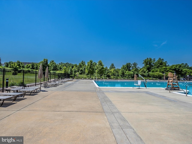 view of swimming pool with a patio