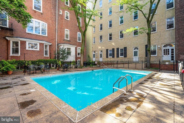 view of swimming pool featuring a patio