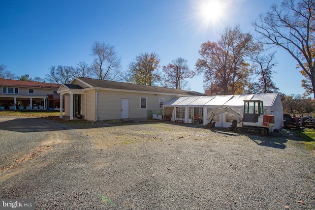 view of front of property featuring an outbuilding