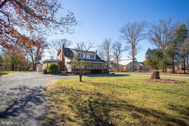 view of home's exterior with a lawn