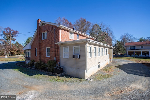 view of home's exterior with cooling unit