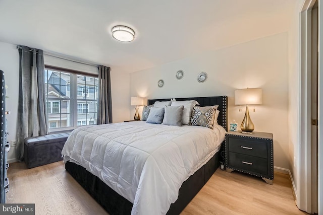 bedroom with light hardwood / wood-style flooring