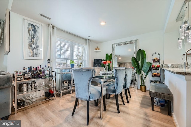 dining room with light wood-type flooring