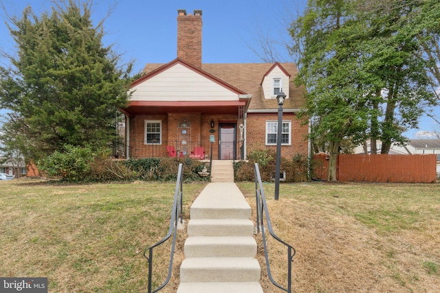 bungalow-style home featuring a porch and a front lawn