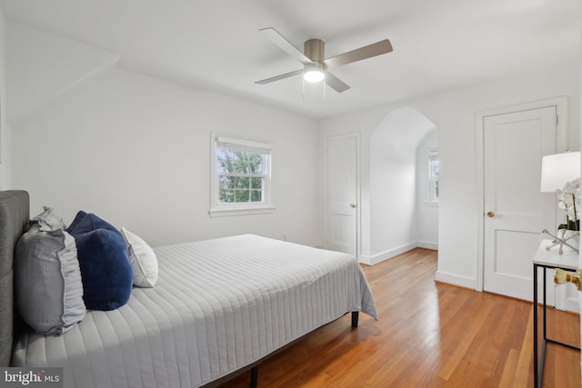 bedroom with hardwood / wood-style flooring and ceiling fan